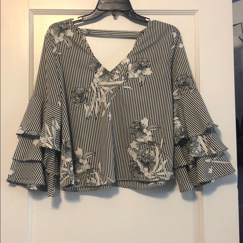 Woman’s black and white floral blouse